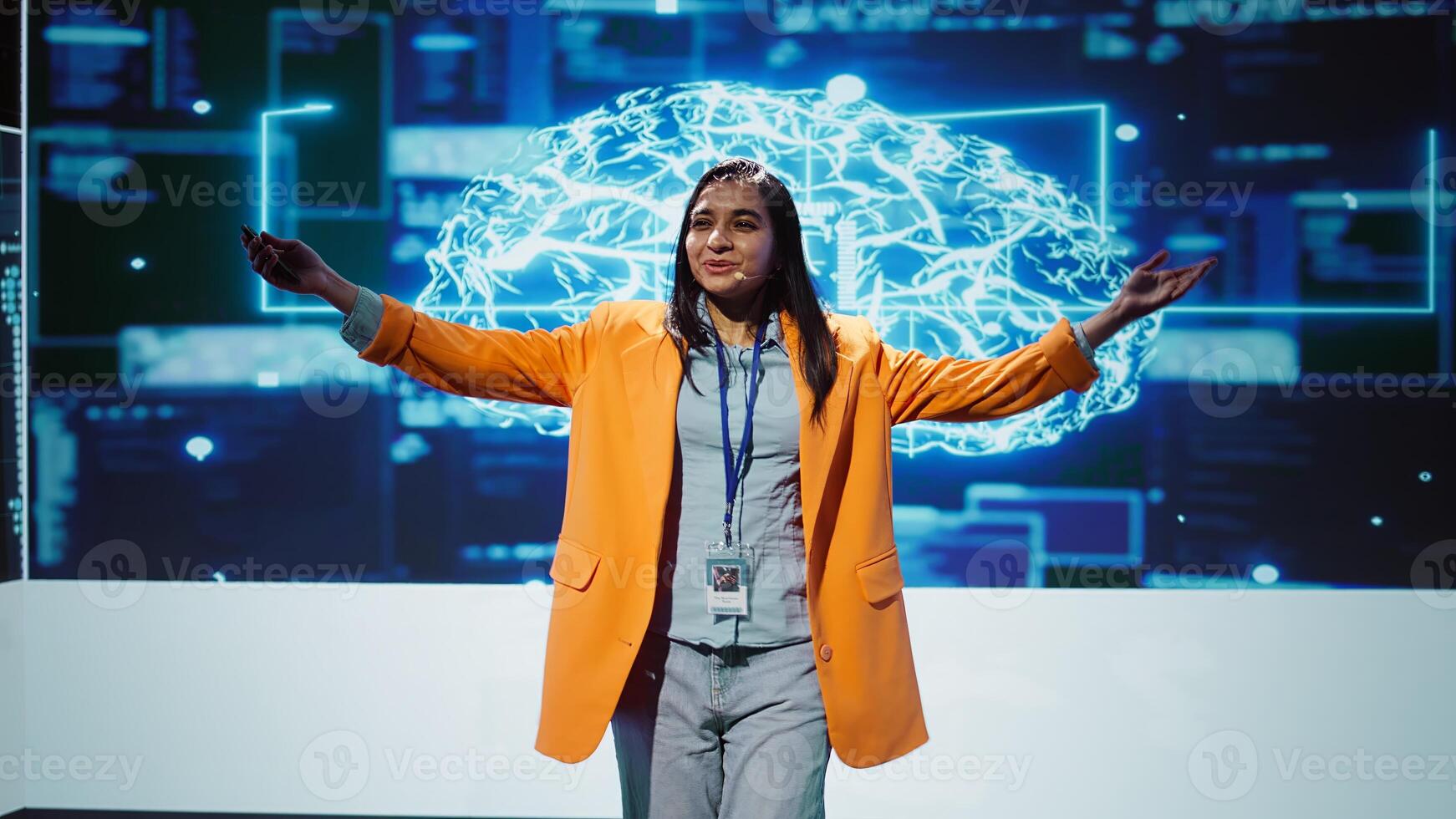 Speaker talking with world leading technology experts and innovators meeting at event to do deep dive into artificial intelligence technology. Expert showcasing latest innovations in AI, camera B photo