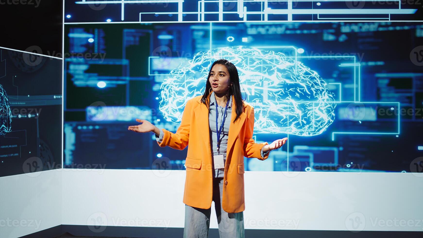 Lively speaker talks at AI event gathering tech startups managers, investors and academics. Expert hosts sessions geared towards helping IT business leaders tap into artificial intelligence, camera B photo