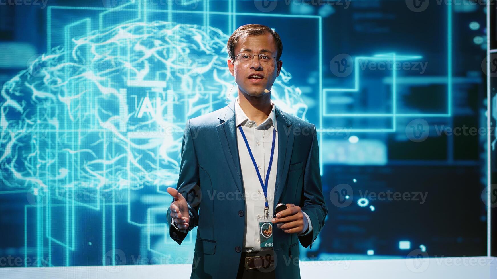 Presenter talking in front of world leading technology specialists and researchers meeting at artificial intelligence conference. Data scientist showcasing latest innovations in AI industry, camera A photo