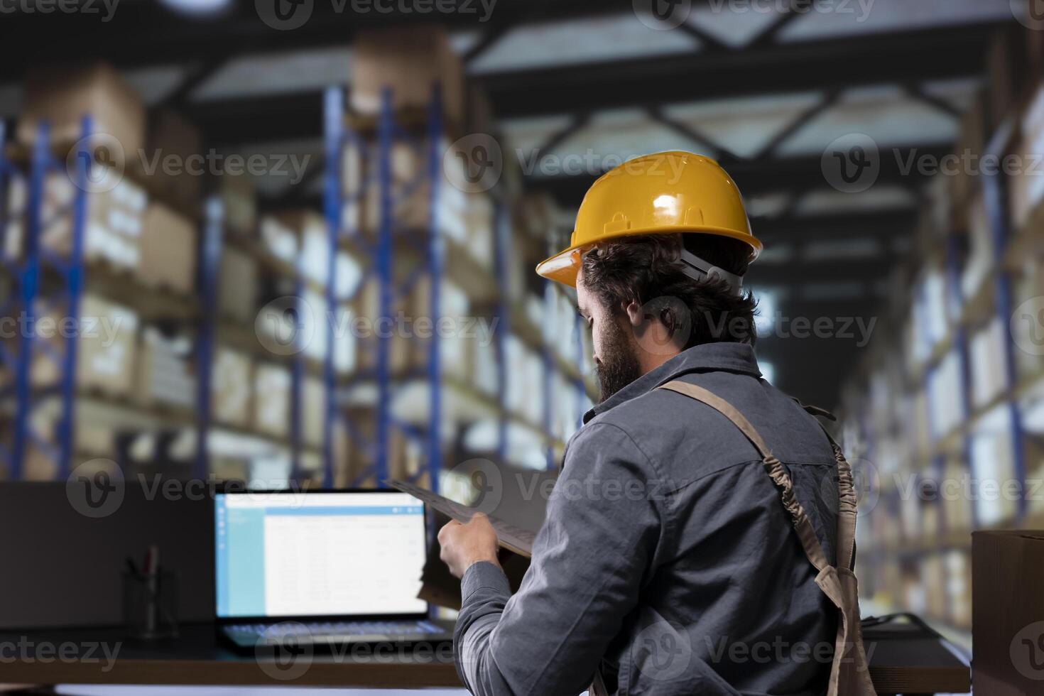 Production supervisor dealing with inventory management in depot, reading list of stock invoices and orders for distribution. Engineer in warehouse planning new merchandise shipment. photo