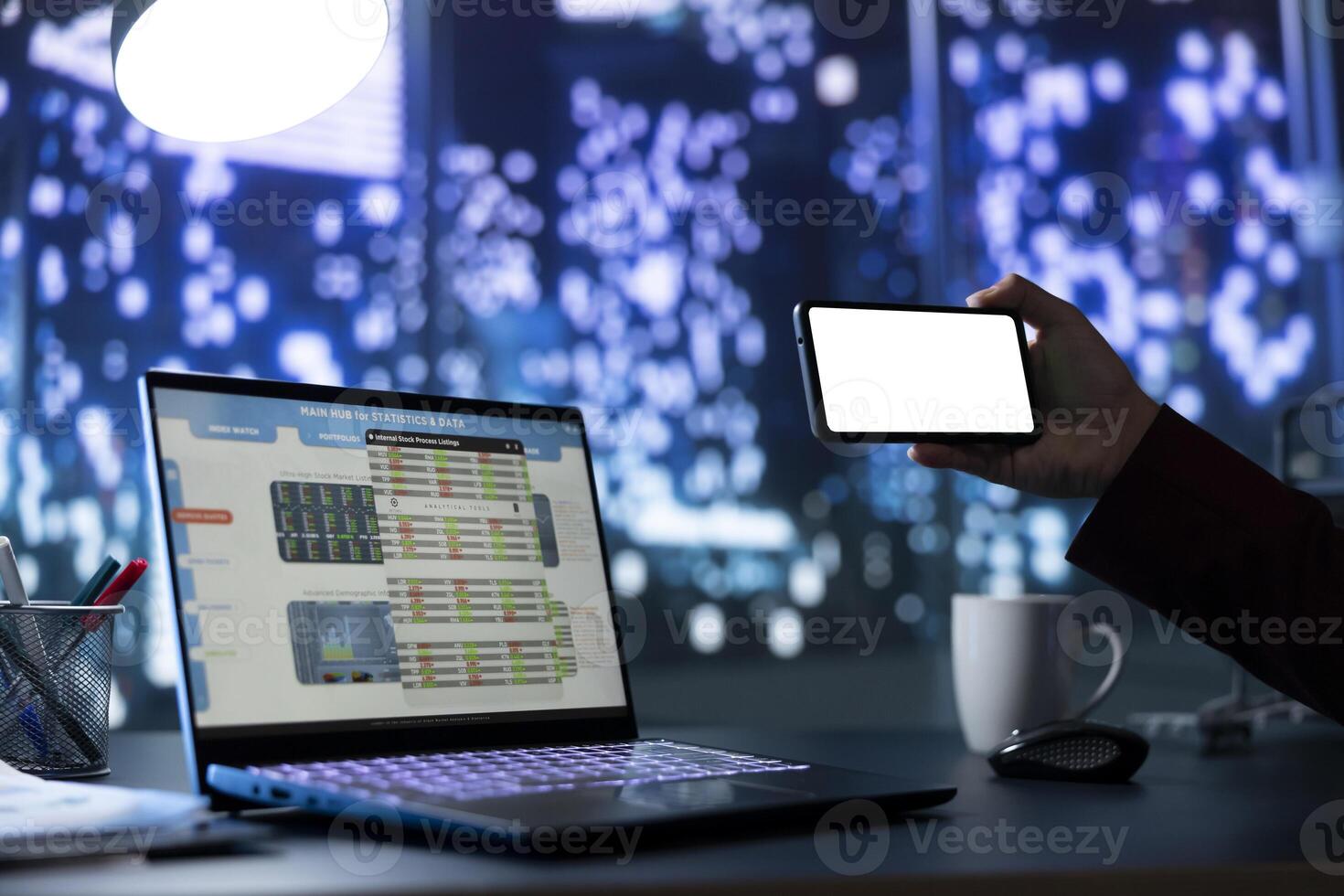 Qualified director manages famous global business and is looking at mobile device with white screen interface. In skyscraper office building, company owner uses blank copyspace display. photo