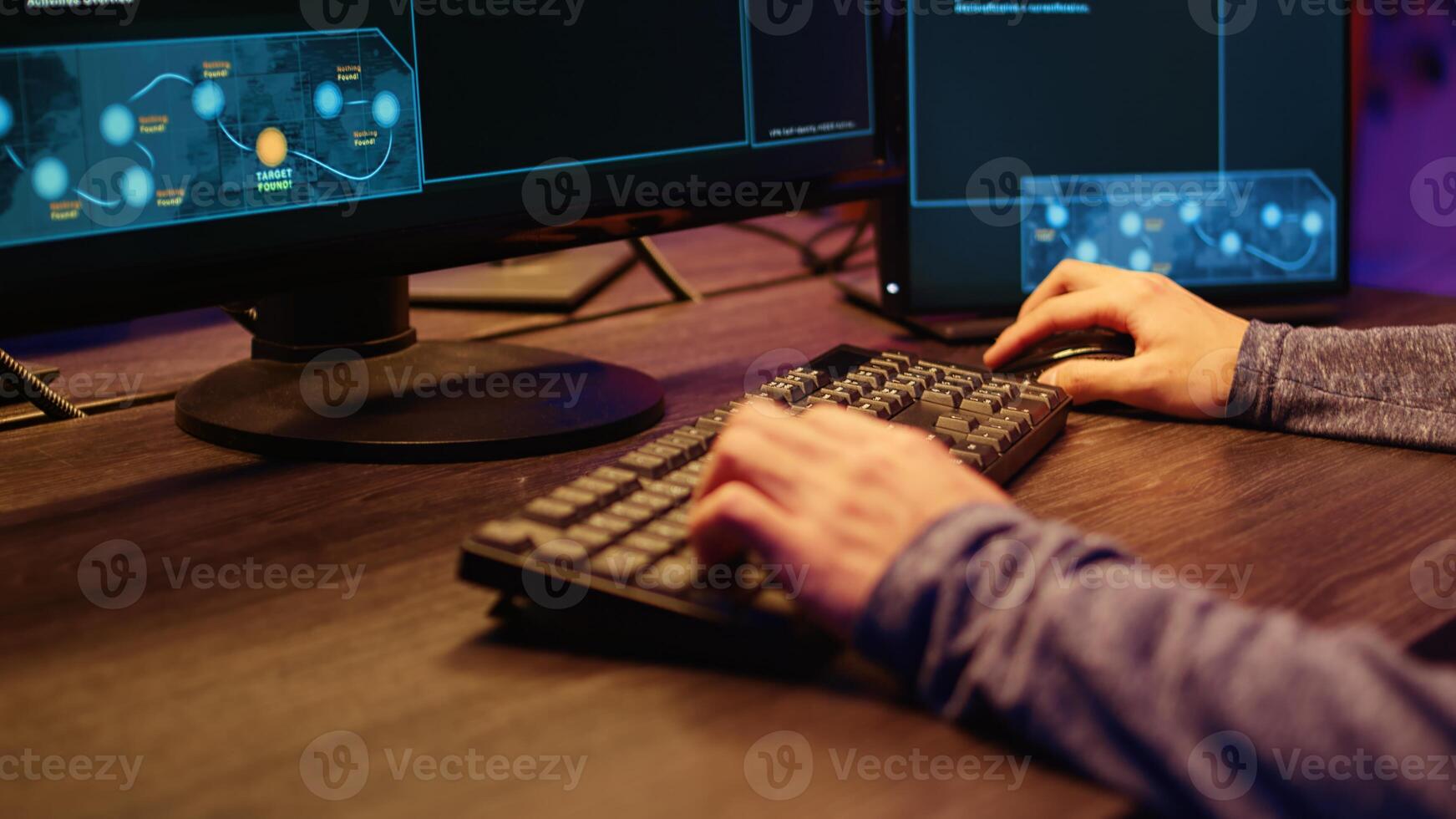 Hacker in secret underground shelter typing on keyboard, writing lines of code on computer, trying to get past security systems with virus. Scammer working on hacking script, close up shot photo