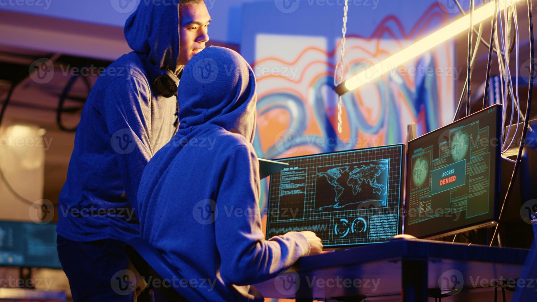 Hackers in secret underground warehouse trying to steal valuable data by targeting governmental websites but getting access denied error message, having cyber attacks rejected photo
