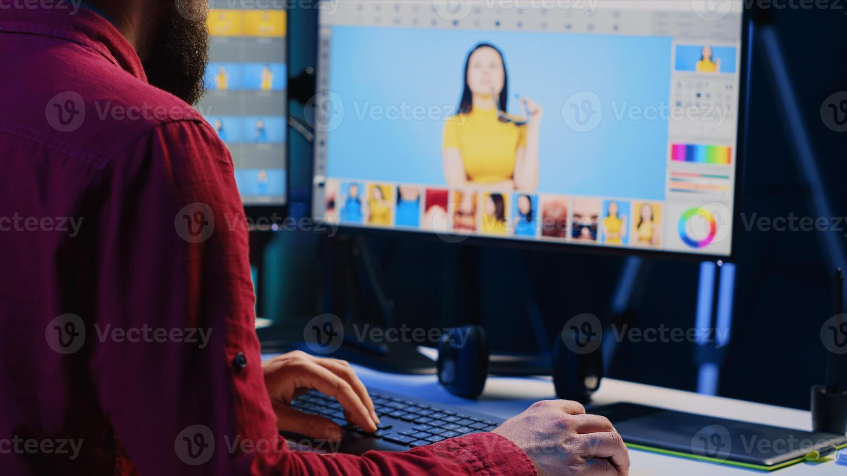 Photographer using advanced photo editing software to make improvement to images quality. Photo editor utilizing specialized photographs retouching application to make adjustments