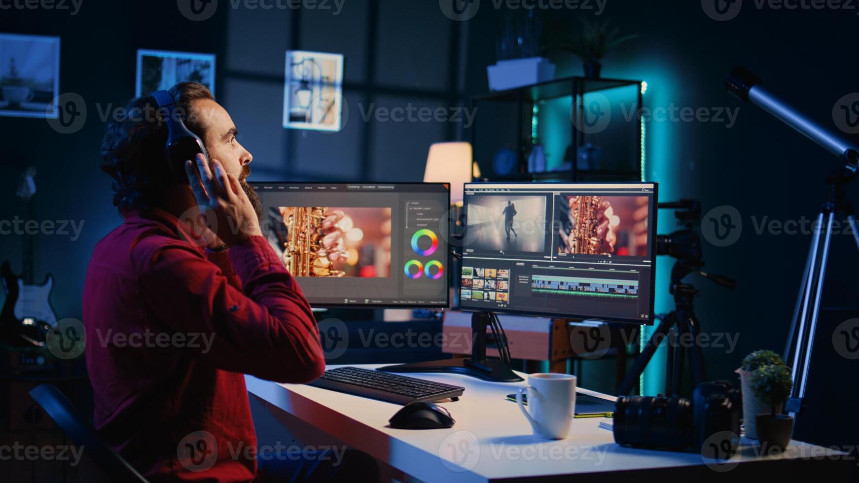 Videographer uses software to create visual effects for projects while relaxing with some music. Professional wearing headphones using post production techniques to edit raw footage photo