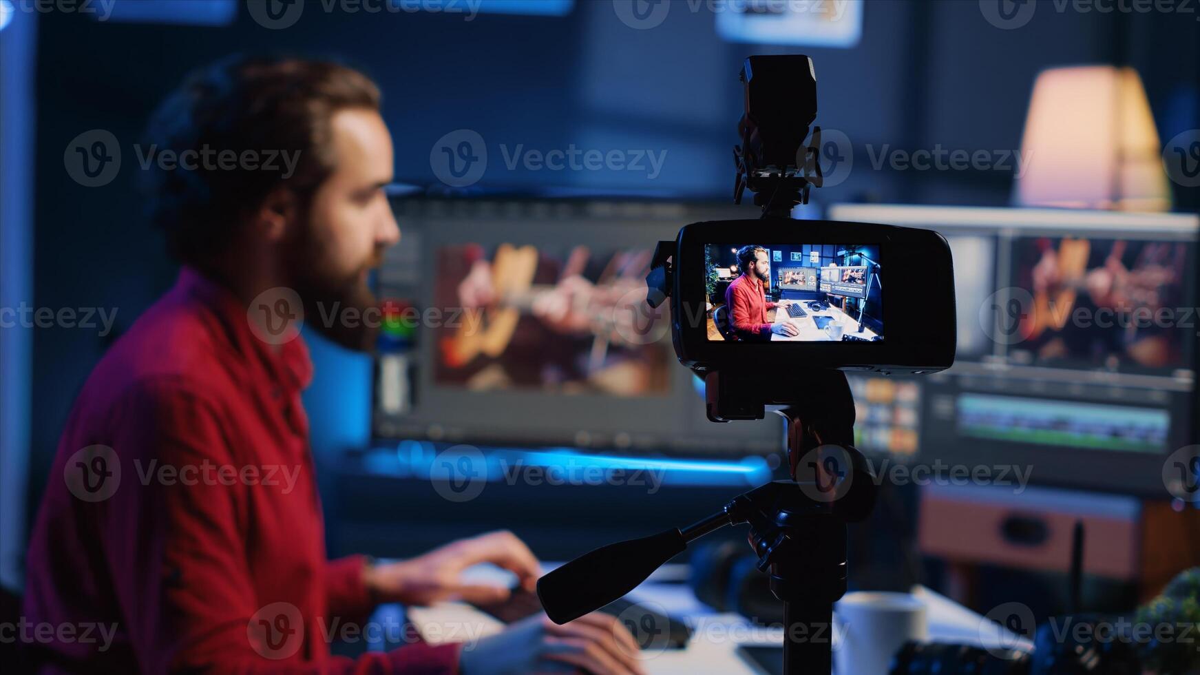 Professional camera equipment used by videographer in creative studio. Focus on production gear in multimedia agency office used by post production editing expert in blurry background photo