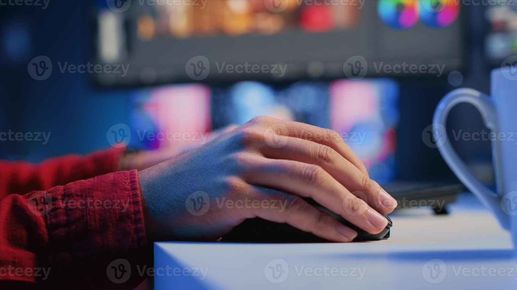 Extreme close up shot of editor selecting key frames to use while doing montage, working from home on computer. Man using mouse to edit movie project footage in office photo