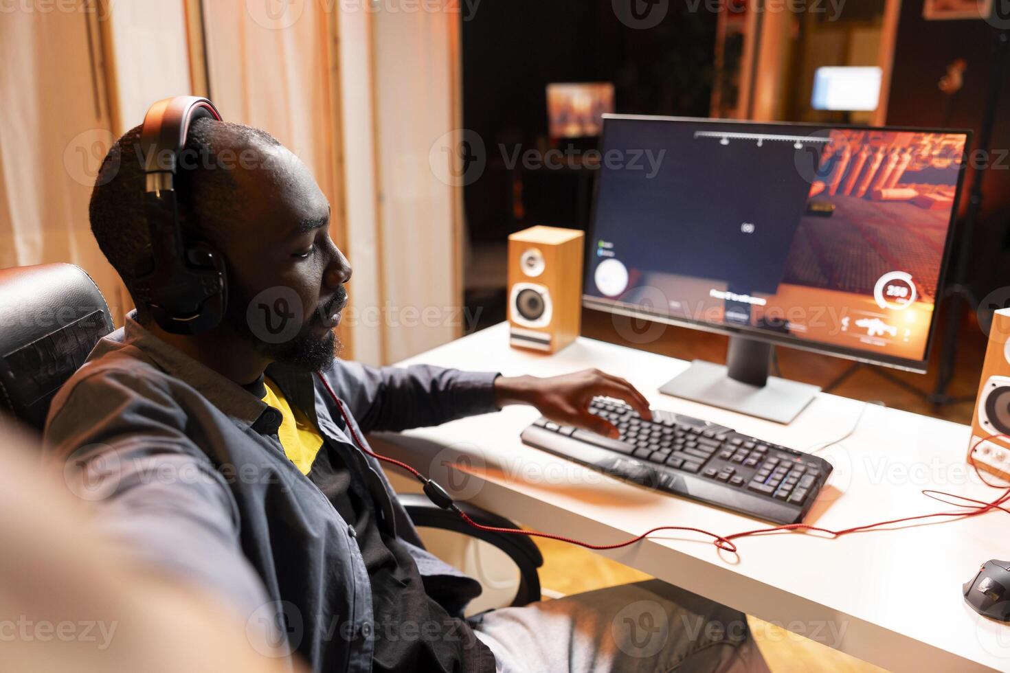 Pro gamer wearing headphones playing game, teaching audience professional esports players skills. Content creator in gaming chair talking with audience, filming tutorial on how to defeat enemies photo