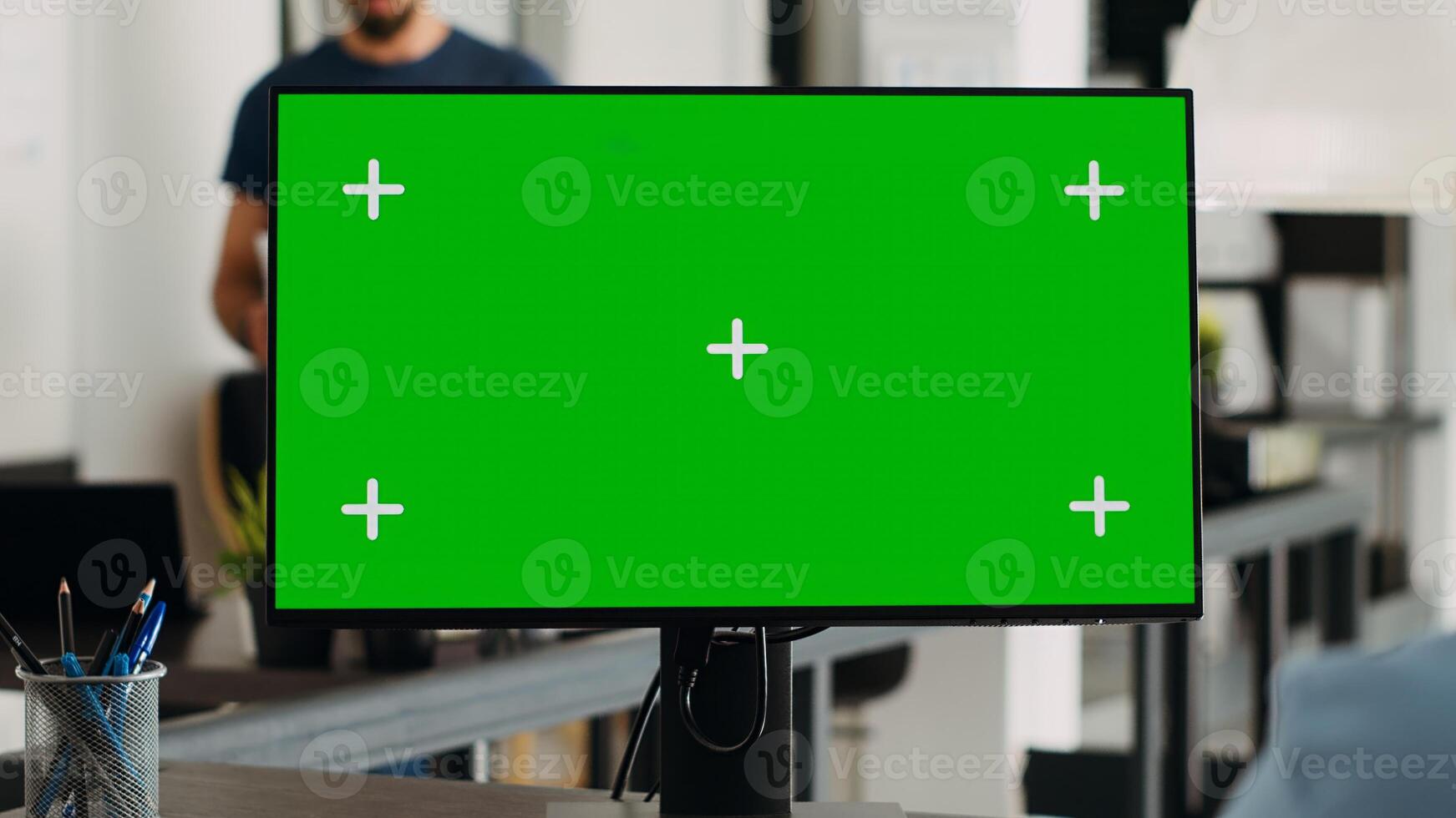 Worker analyzing greenscreen monitor and working on marketing revenue development. Businesswoman checking computer screen with isolated mockup chromakey, digital blank copyspace. photo