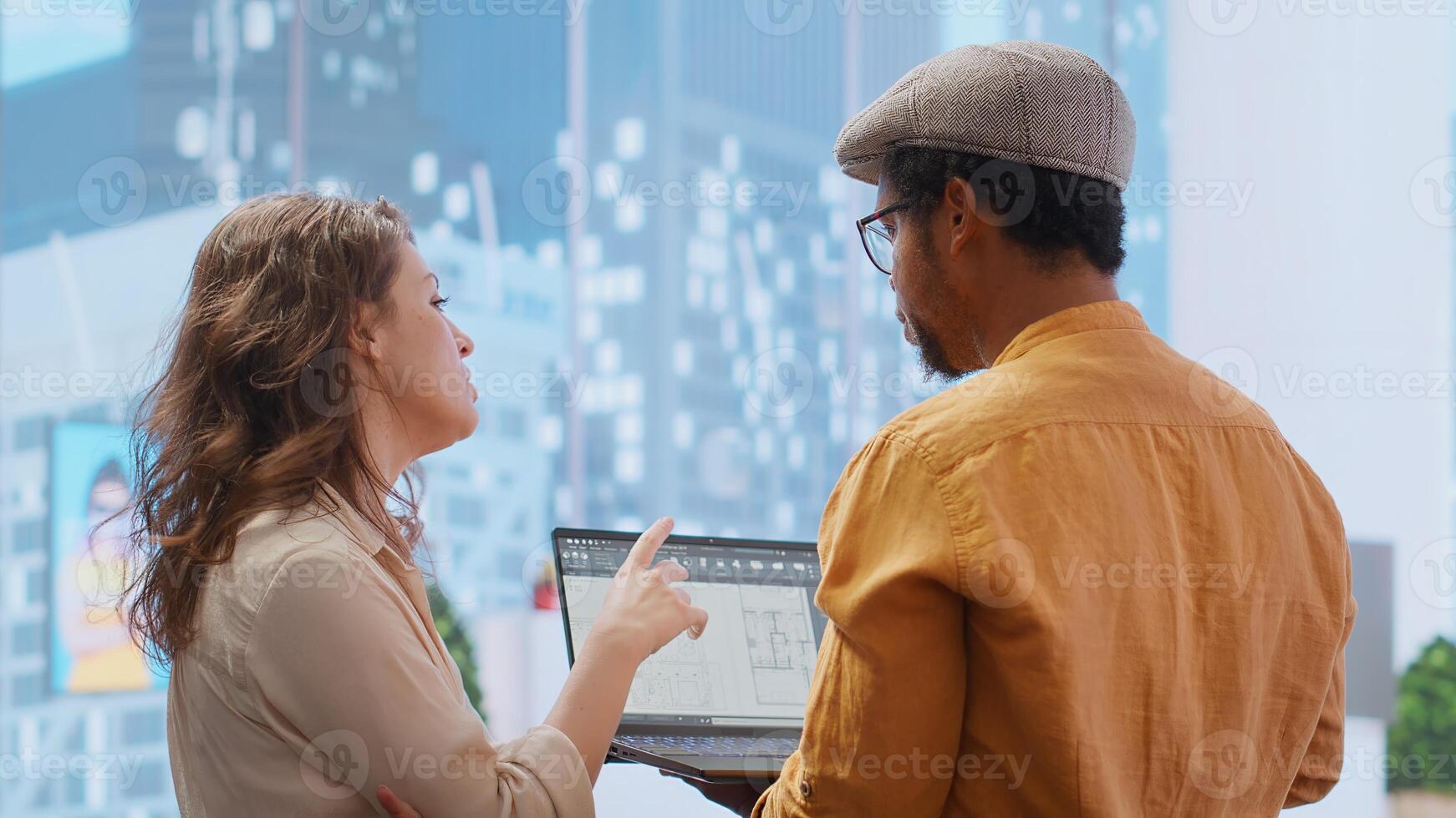 Real estate agent and clients negotiating deals on an office hunt, touring potential workspace property and discussing strategic planning for investment and development. Rental agreement. Camera B. photo