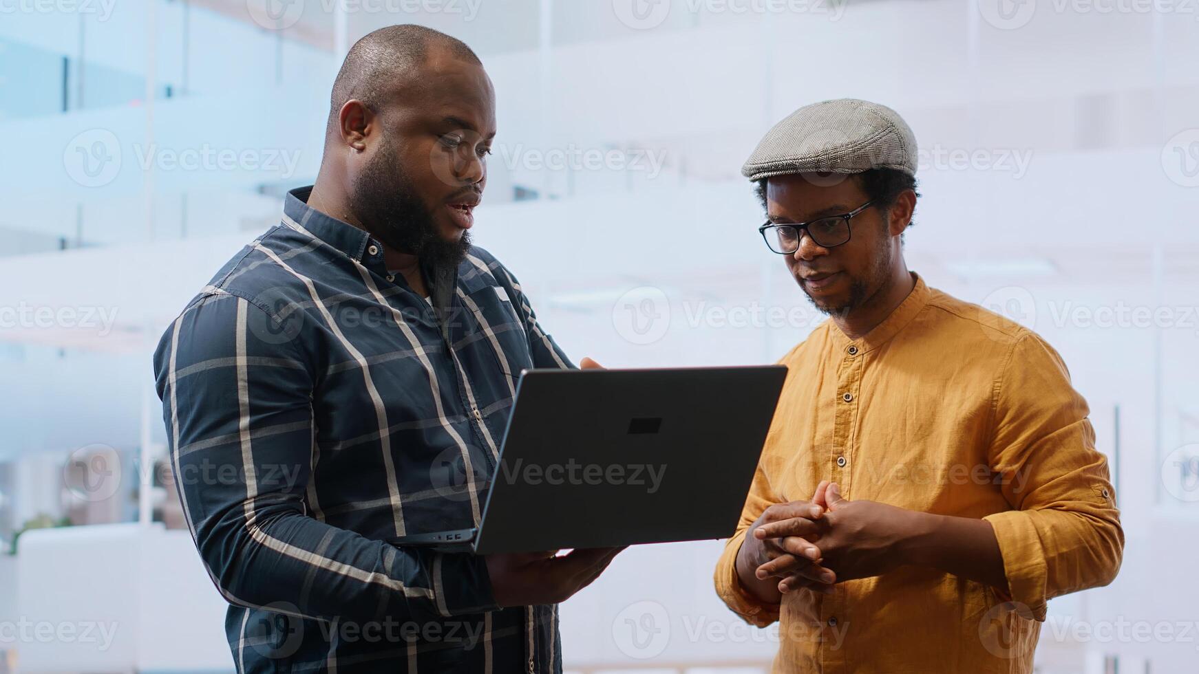 Business management team planning an office relocation and seeing new high class space tour with the broker, analyzing blueprints. Reaching a legal agreement with leasing contract. Camera B. photo