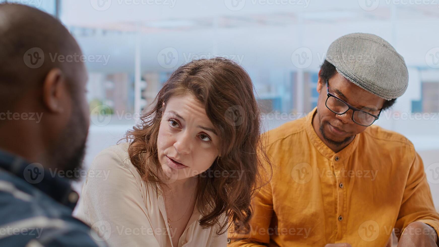 Corporate clients engage in a strategic planning session with a real estate agent, reviewing blueprints and discussing office space relocation to modern urban building. Investment strategy. Camera B. photo