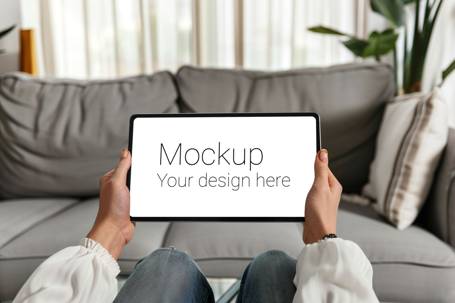 Mockup of black tablet in hand on living room background psd