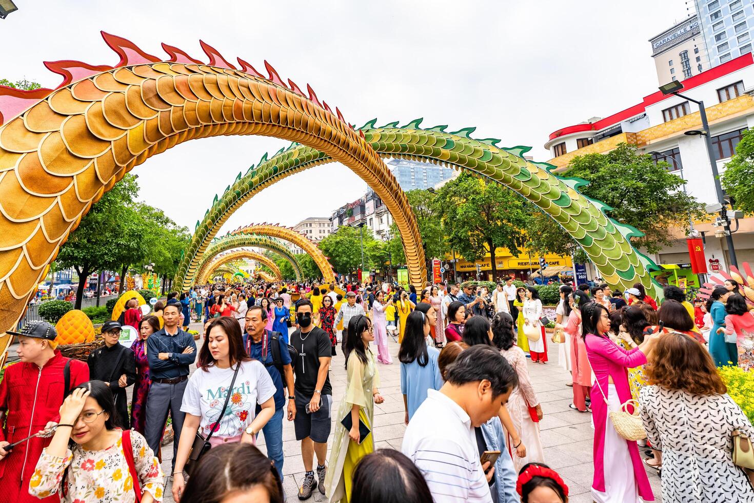 Walking street morning Lunar New Year at downtown with flowers decorated along street attract many tourists to visit, in Ho Chi Minh City, Vietnam photo