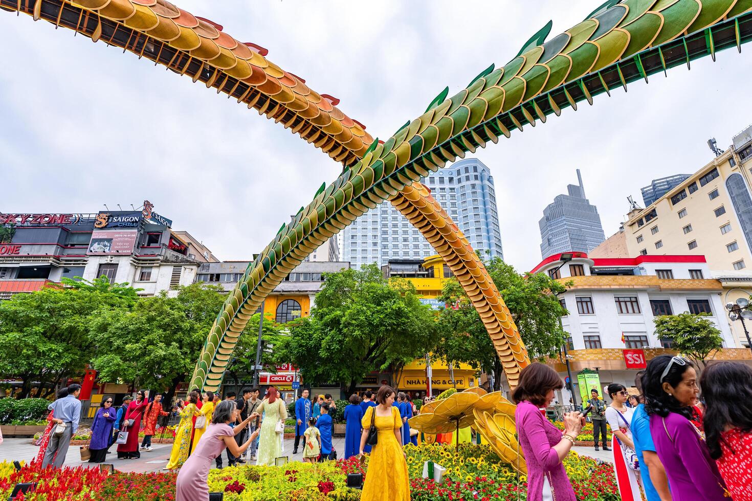 Walking street morning Lunar New Year at downtown with flowers decorated along street attract many tourists to visit, in Ho Chi Minh City, Vietnam photo