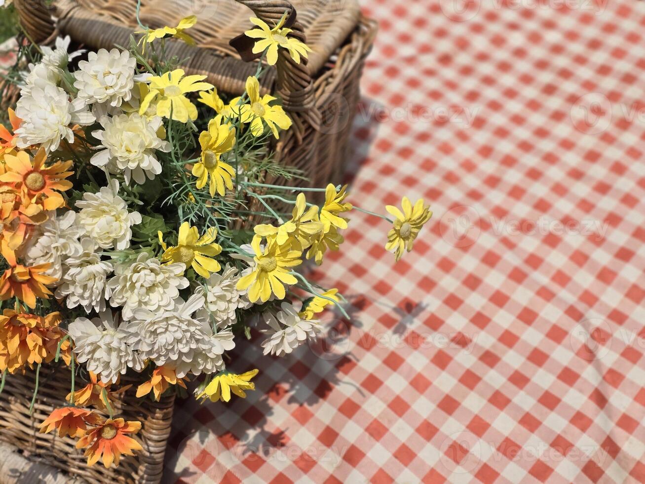 Close-up of a basket of flowers, Beautiful bouquet of wild flowers in a small wicker basket. photo