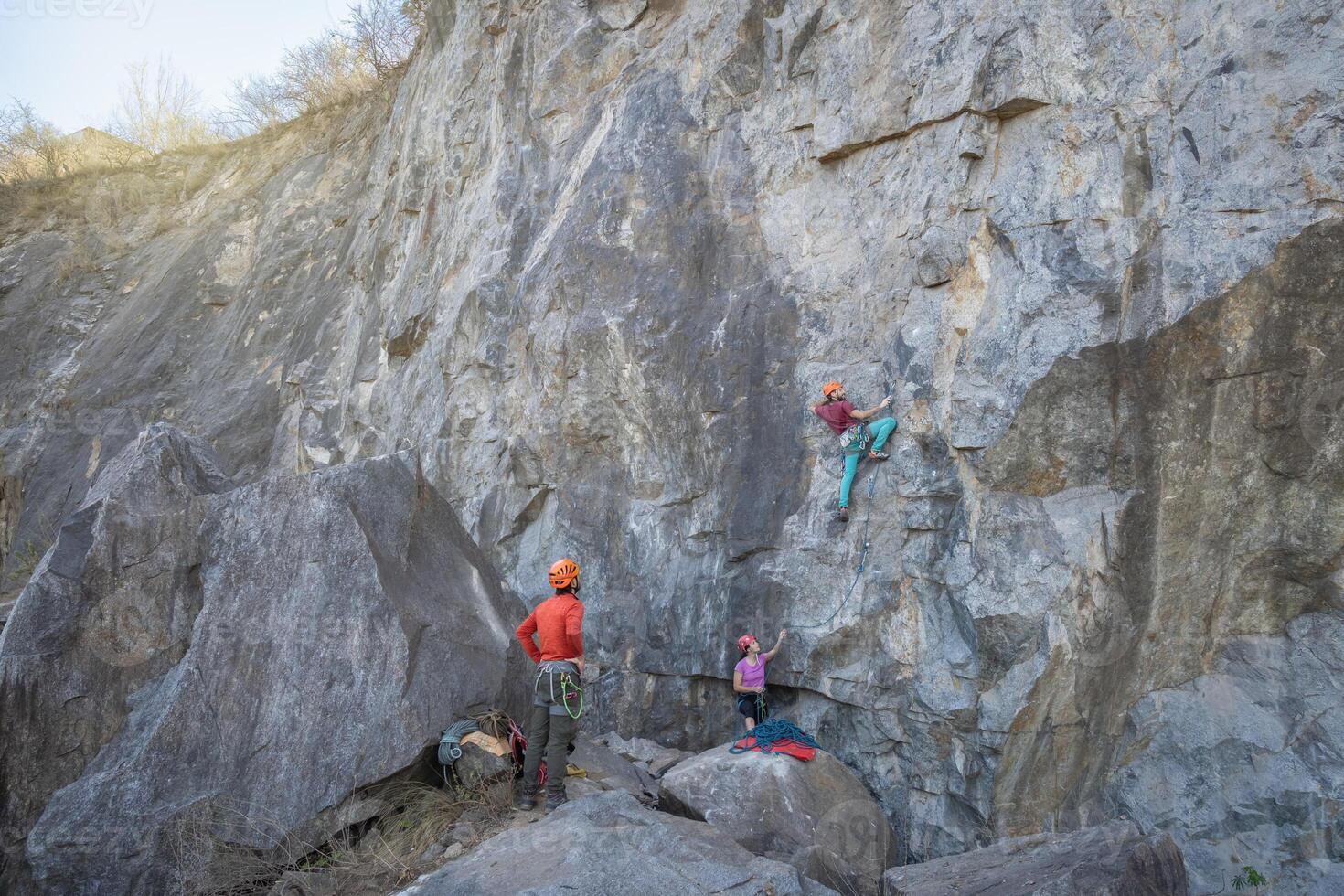 Climbing in the mountains. A man climbs a rock. photo