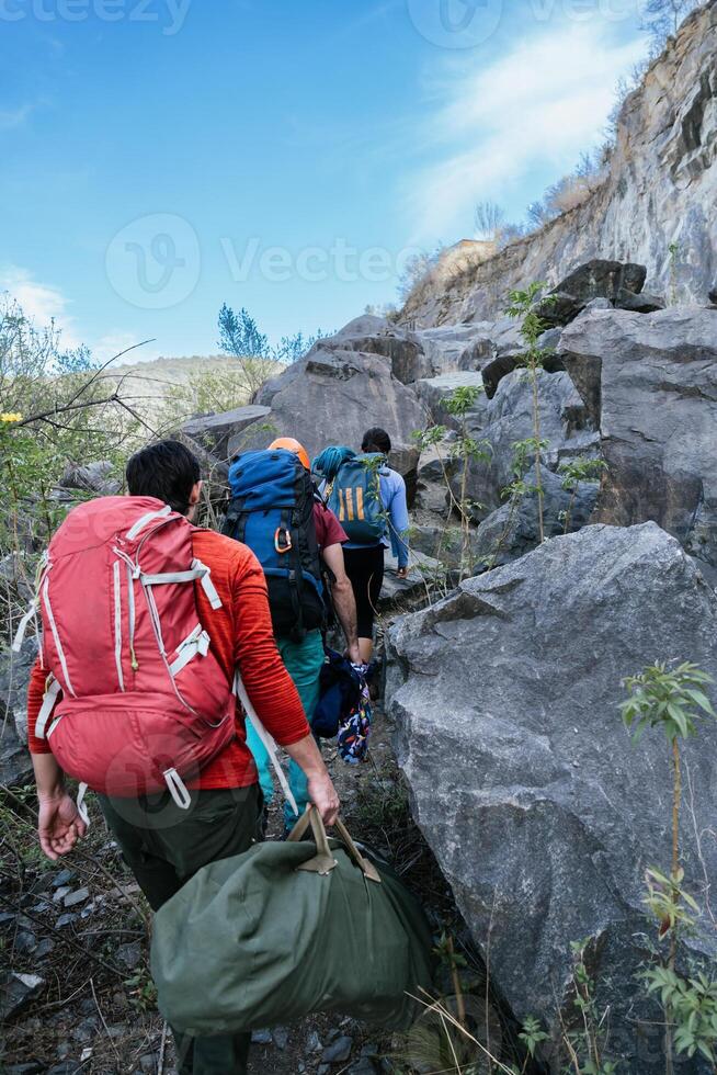 Hikers trekking through scenic mountain trails, embracing nature's beauty and adventure. photo