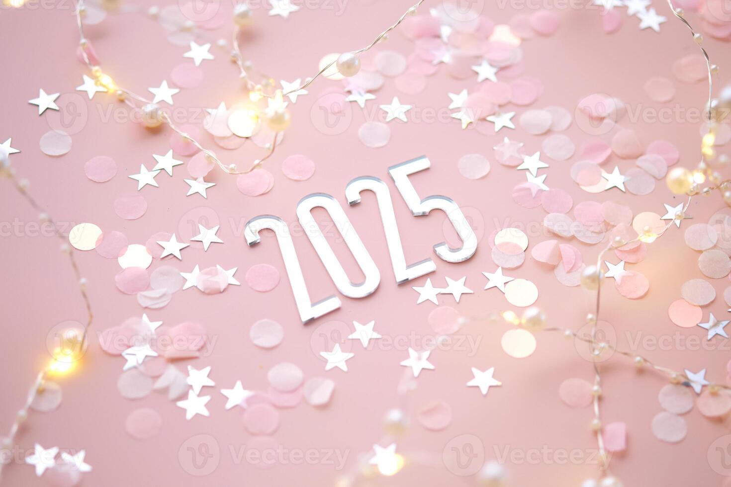 New Year 2025 pink background. Number of the coming year in Christmas decoration. photo