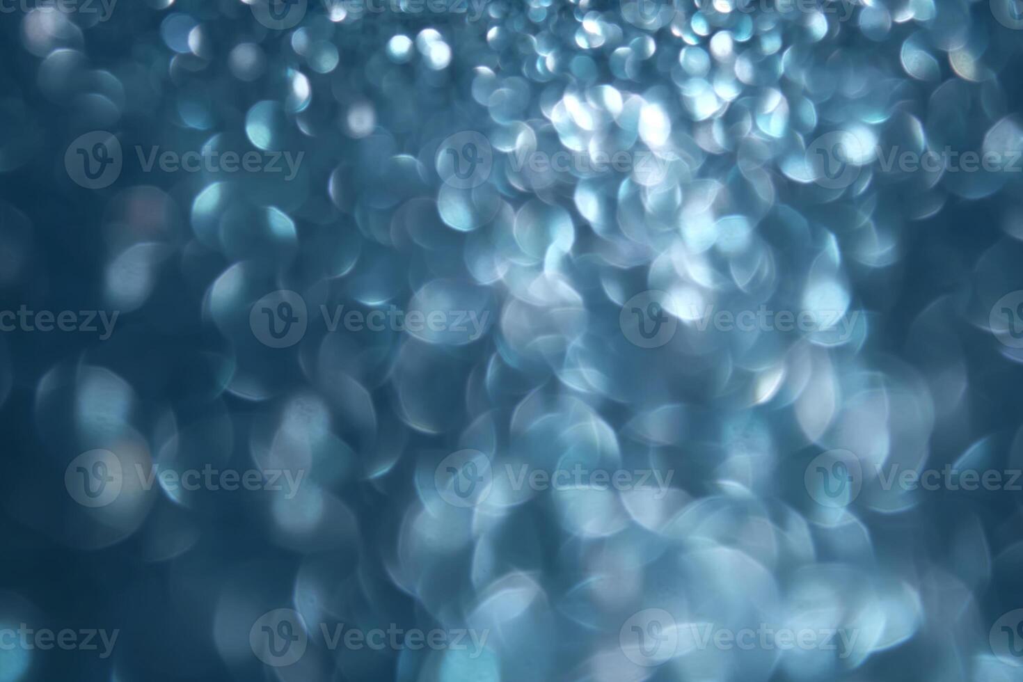 Abstract blue festive christmas background with bokeh. photo