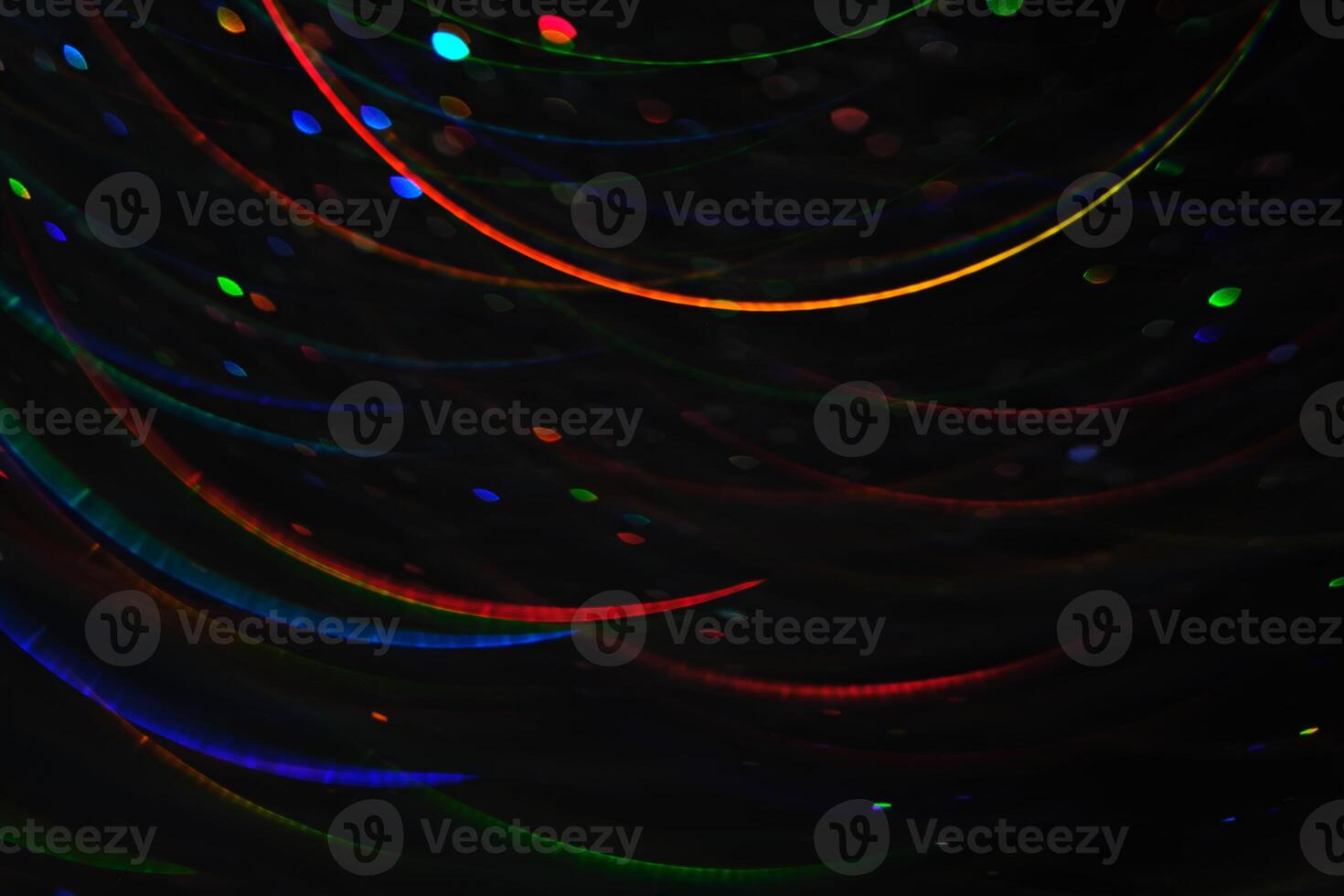 Abstract black background with bokeh of different colors. photo