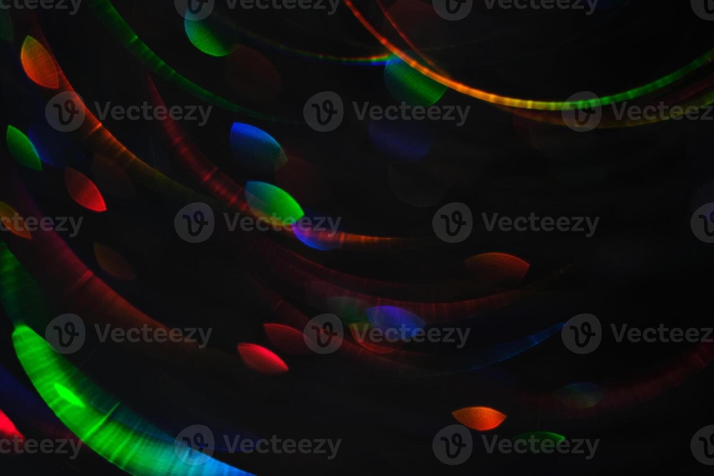 Abstract black background with bokeh of different colors. photo