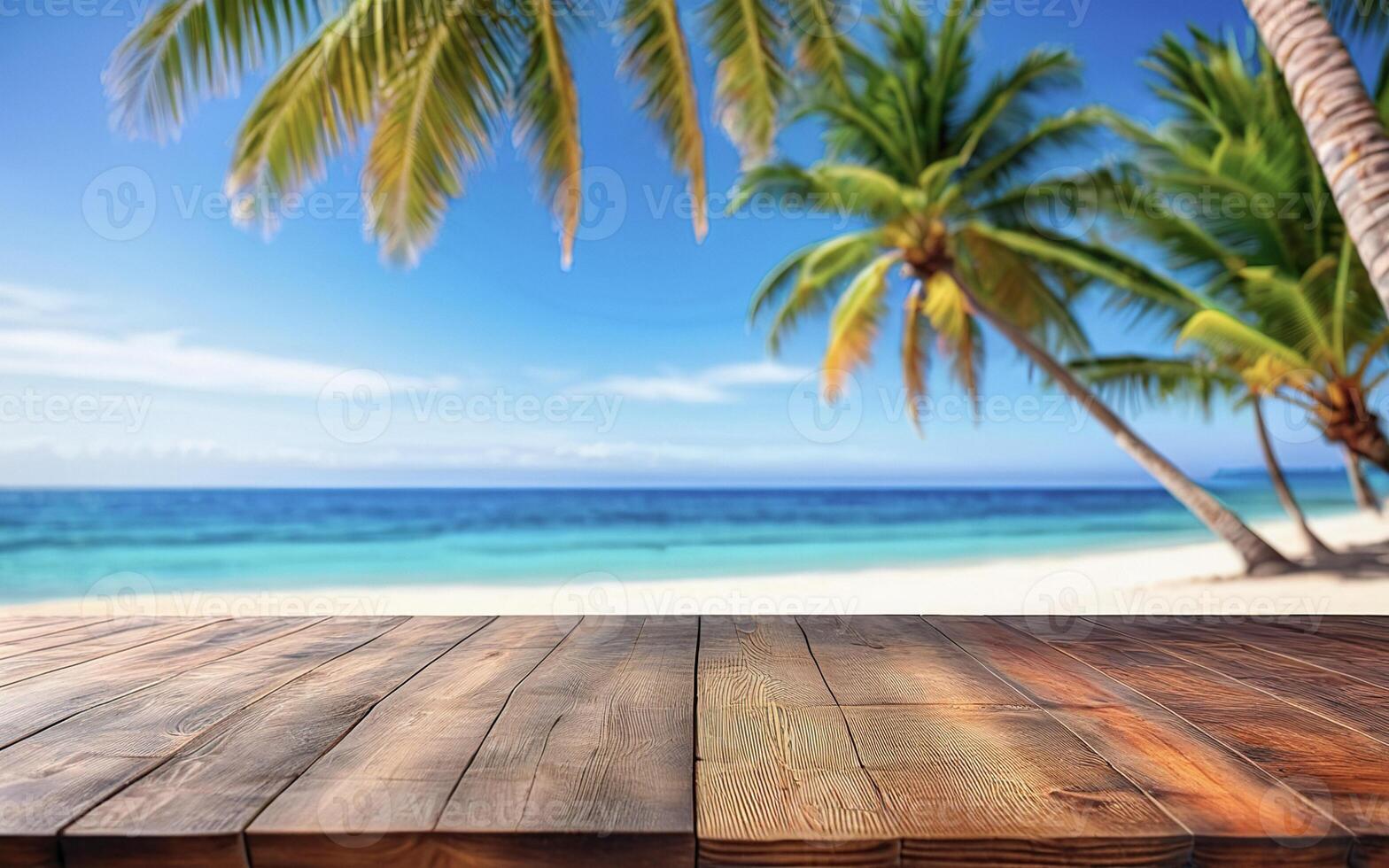 wooden empty table on the beach under a palm tree with an ocean view photo