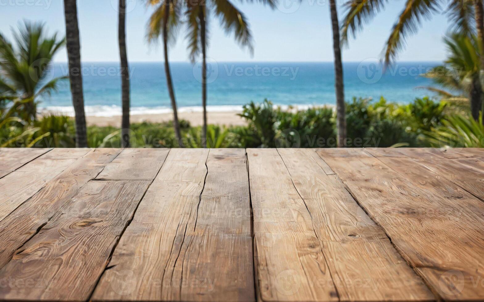 wooden empty table with palm trees, beach and ocean view photo