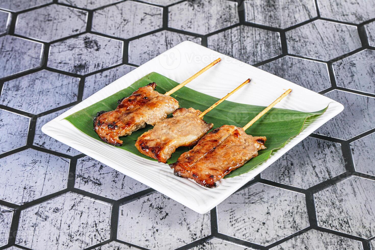 Thai cuisine - grilled pork skewer photo