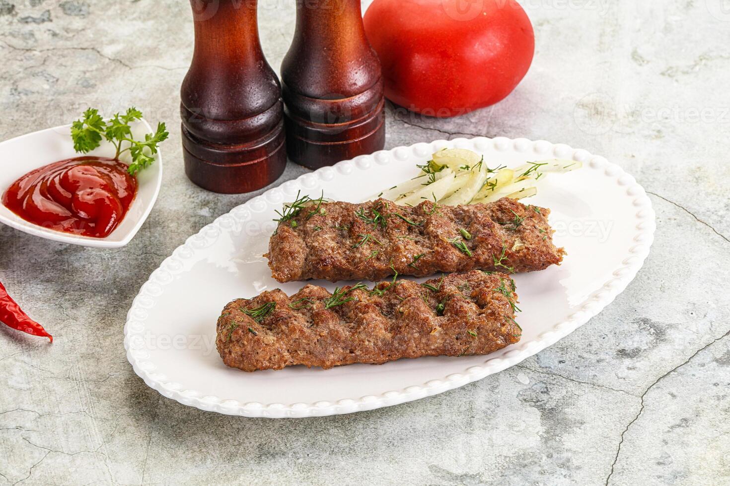 Kebab with beef served onion photo