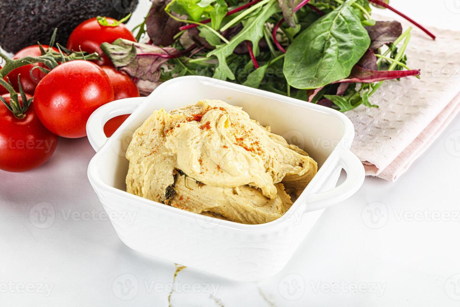 Creamy hummus in the bowl photo