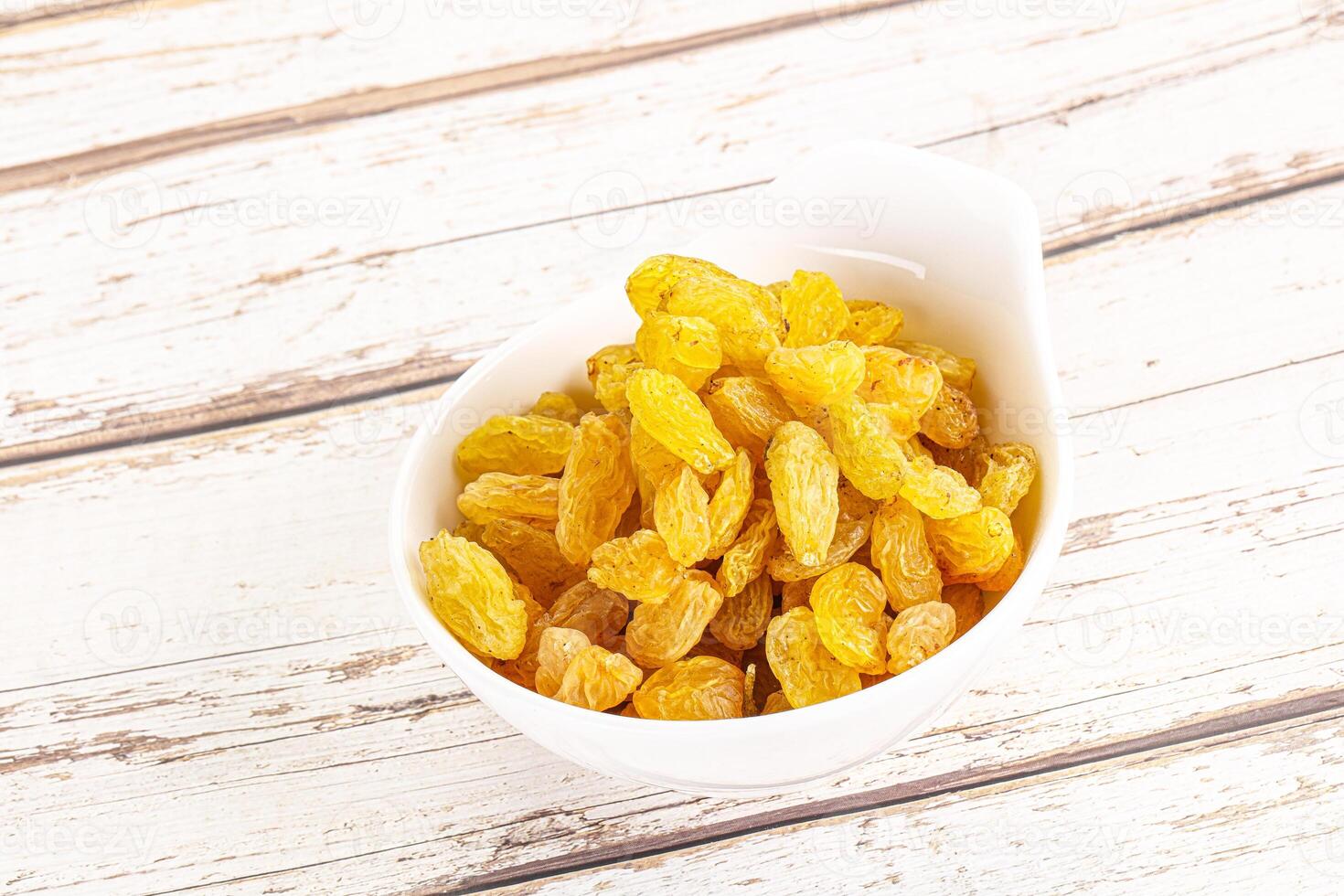 Yellow raisin - dry grape berries photo