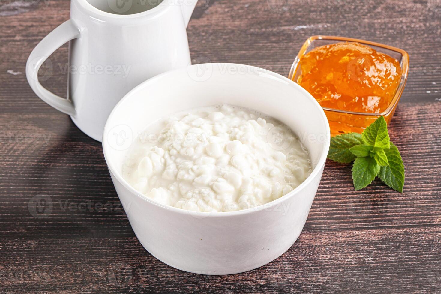 Grain curd with cream and jam photo