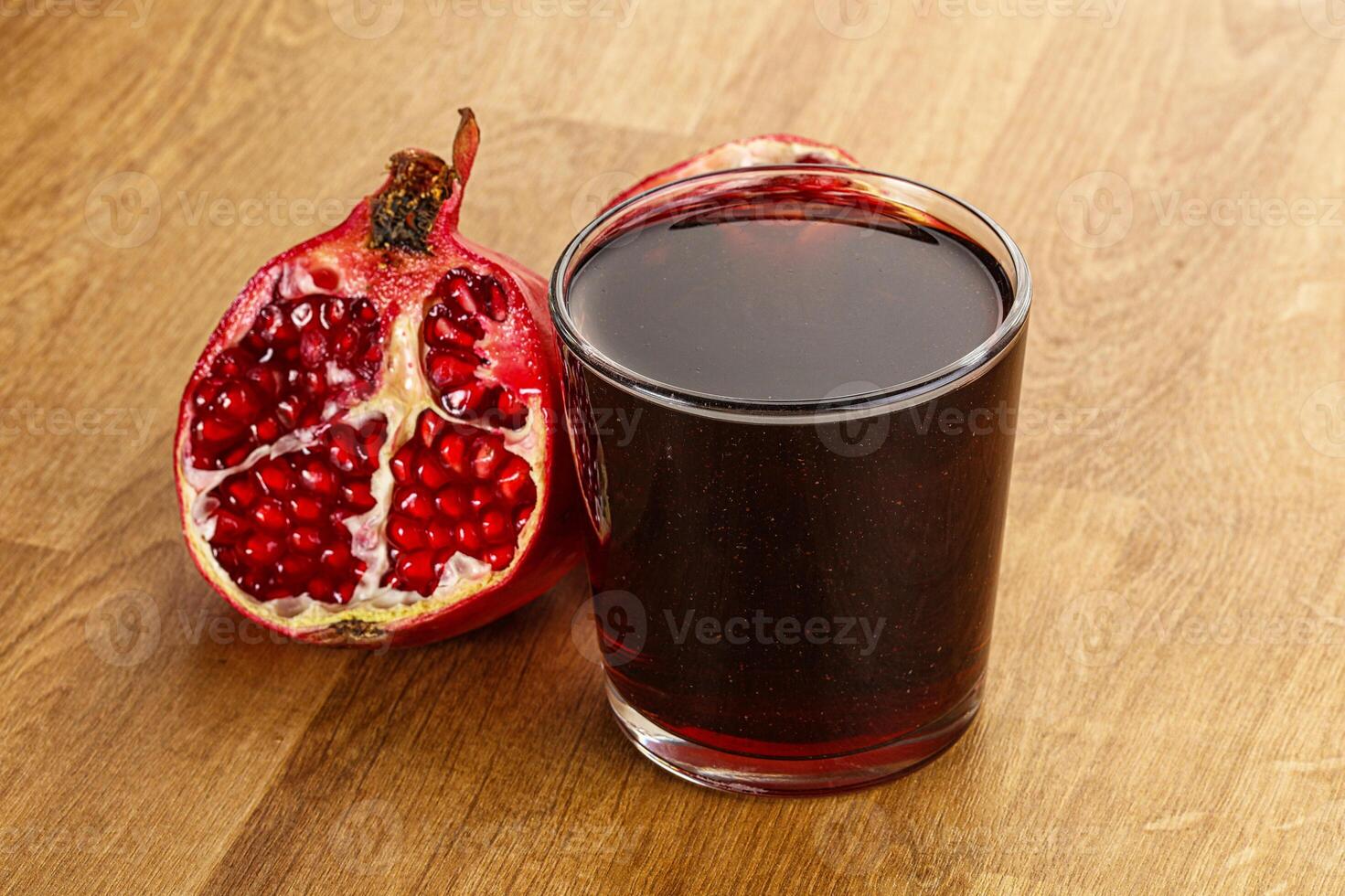 Sweet pomegranate juice in glass photo