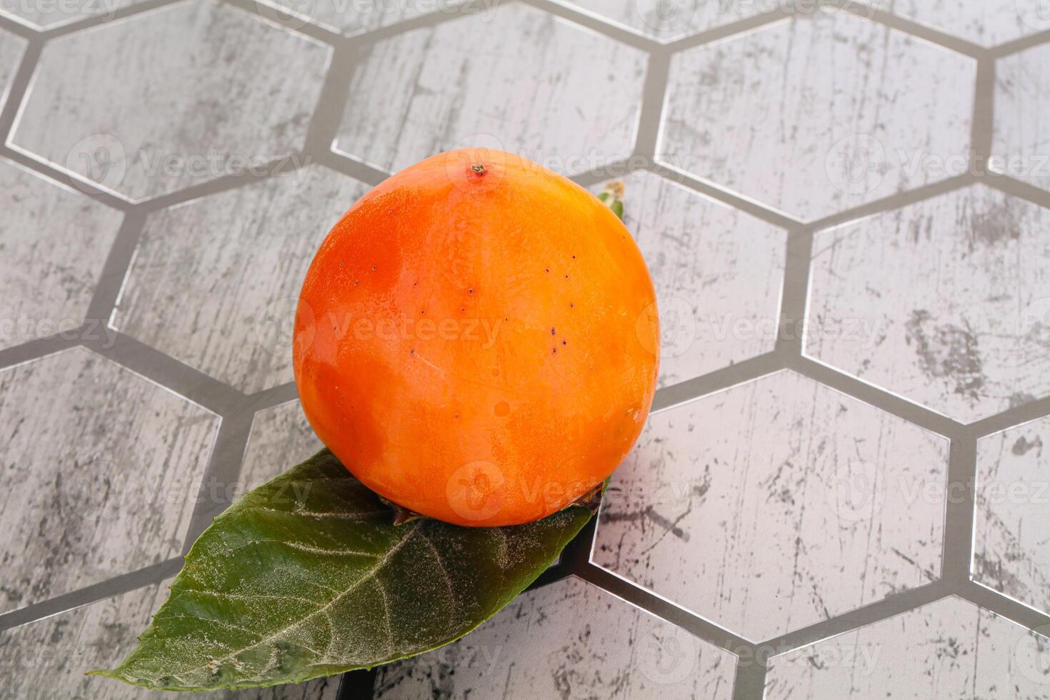 Fresh ripe sweet juicy persimmon photo