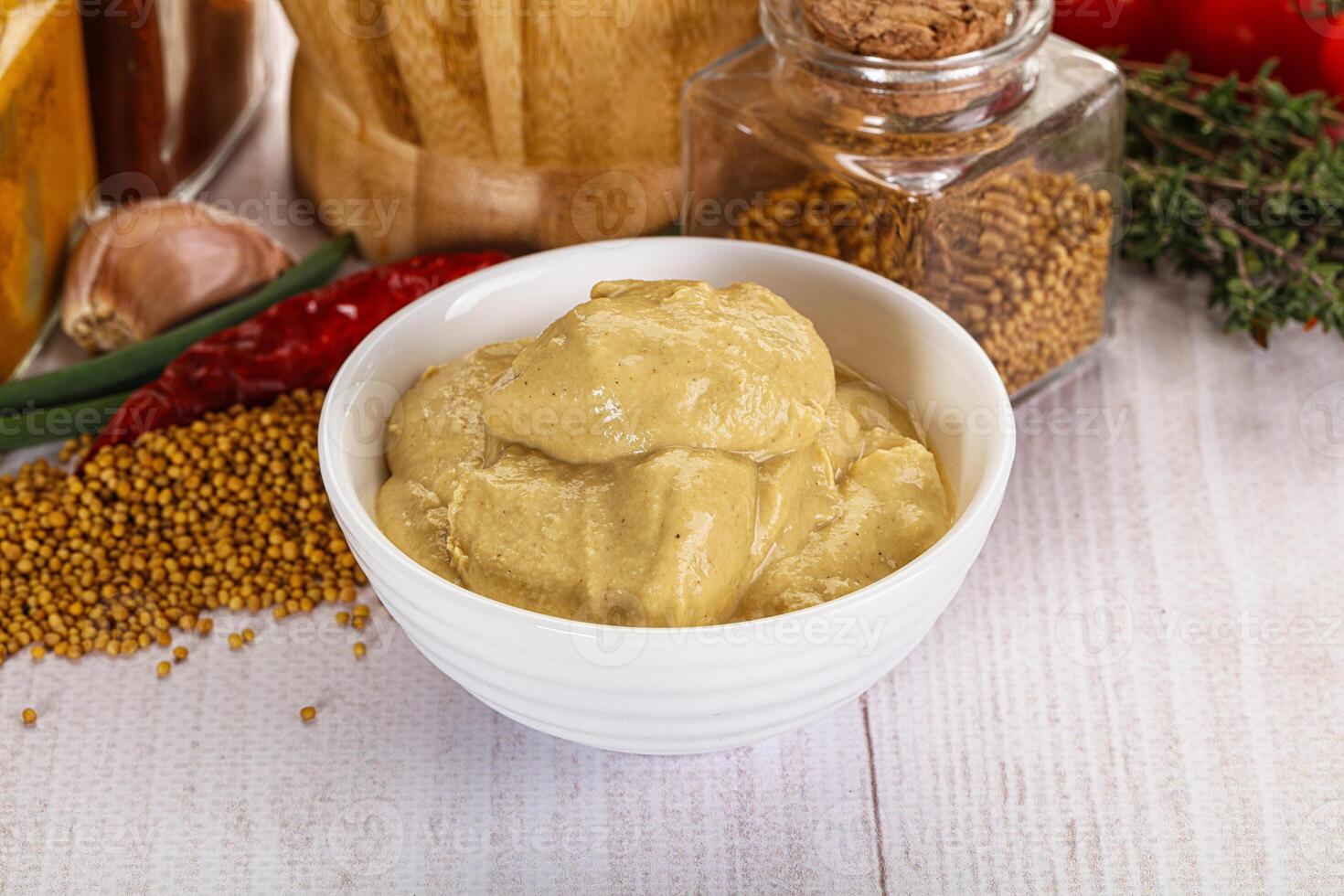 Dijon mustard sauce in the bowl photo