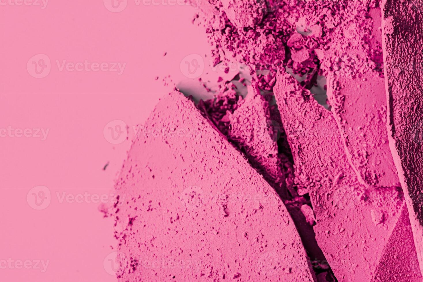 Close-up of Pink Eyeshadow Palette with Crushed Cosmetics Texture photo