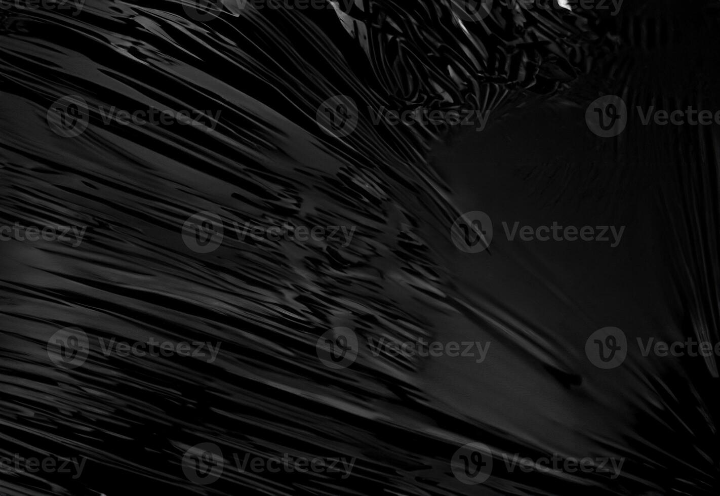 Transparent Plastic Wrap Texture on Black Background, Ideal for Overlays and Creative Design photo