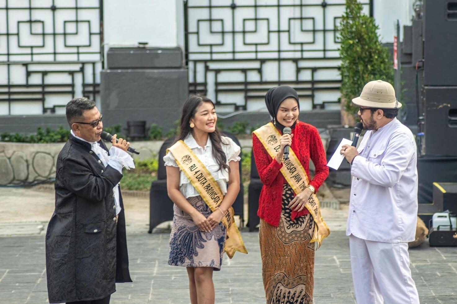 two female tourism ambassadors for East Java who were being interviewed at the soft launching event in the old city of Surabaya, Indonesia, 20 June 2024. photo