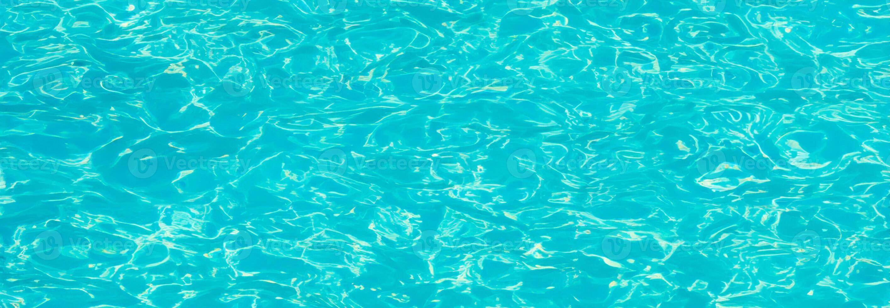 Tranquil Blue Swimming Pool Surface with Water Background photo