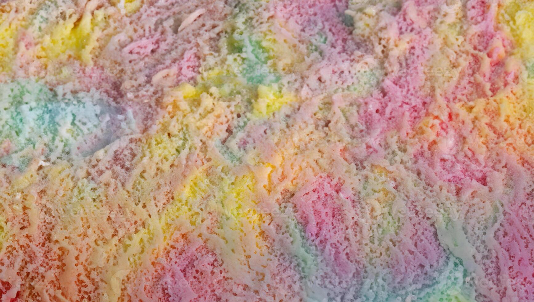 Culinary Composition, Vibrant Rainbow Ice Cream on Textured Surface, Top View with Copy Space photo
