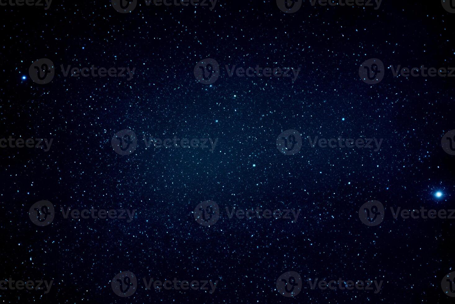 Starry Night Sky Illuminated by Bright Stars photo