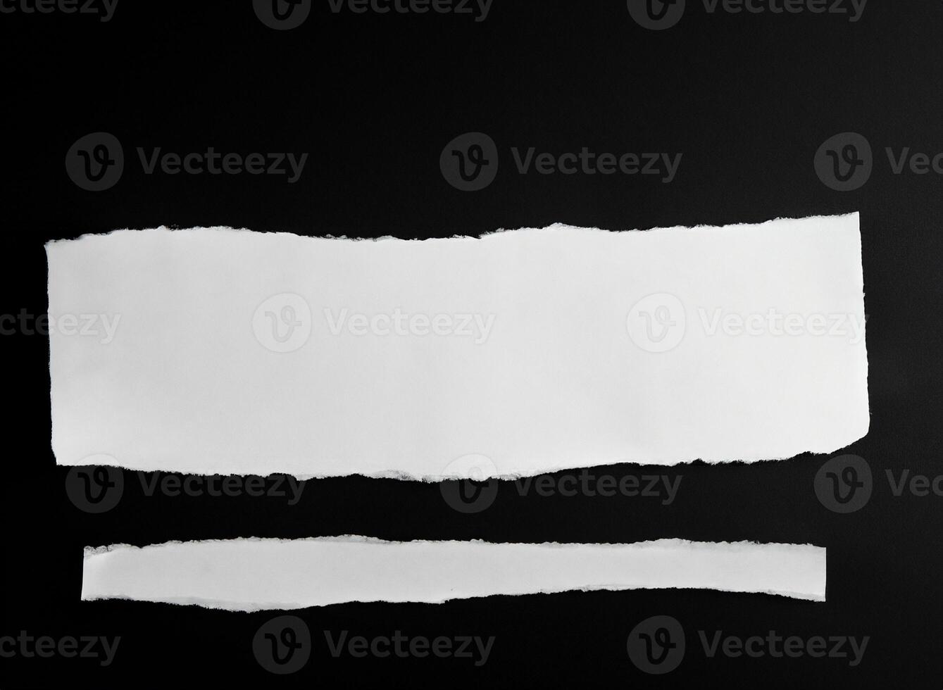Shredded Blank White Paper Strips on Dark Background photo