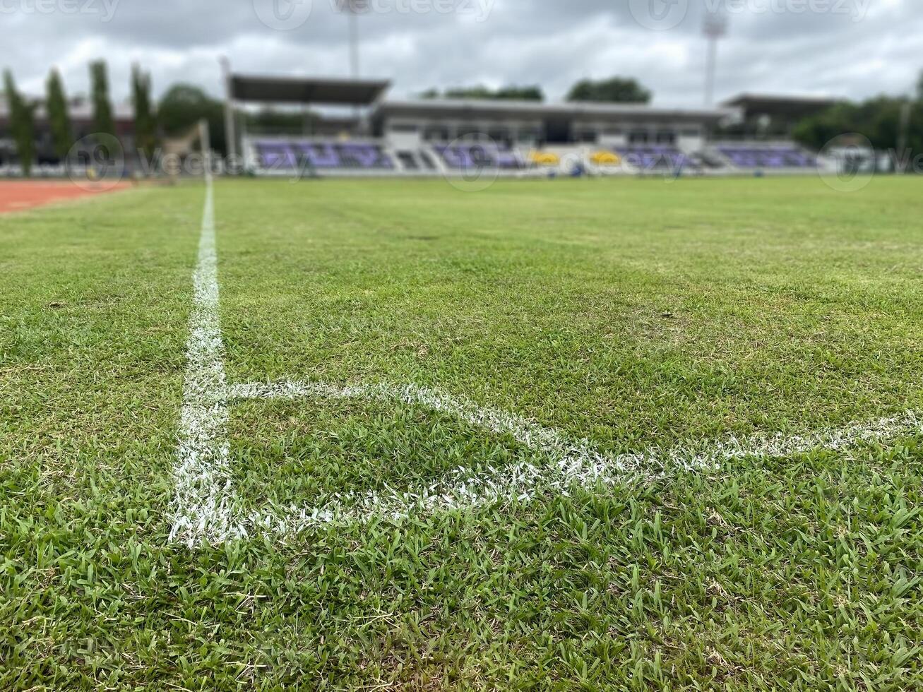 white line at the corner of soccer field in stadium blured background no people. sport concept. photo