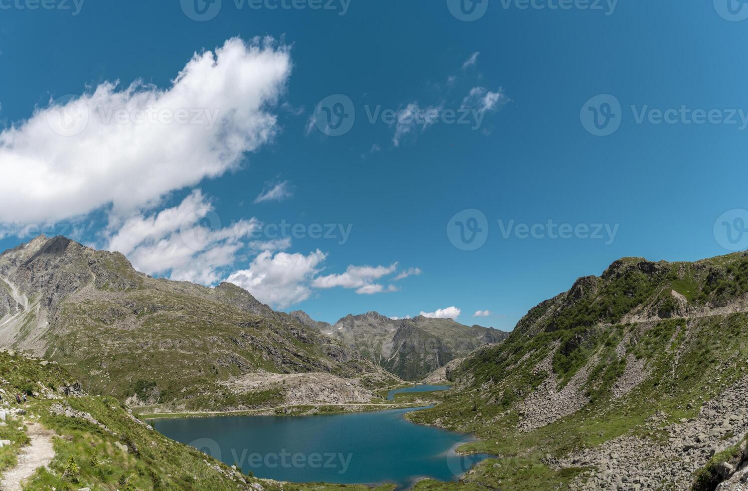 aerial view of a beautiful lake surrounded by the dolomites mountain range photo