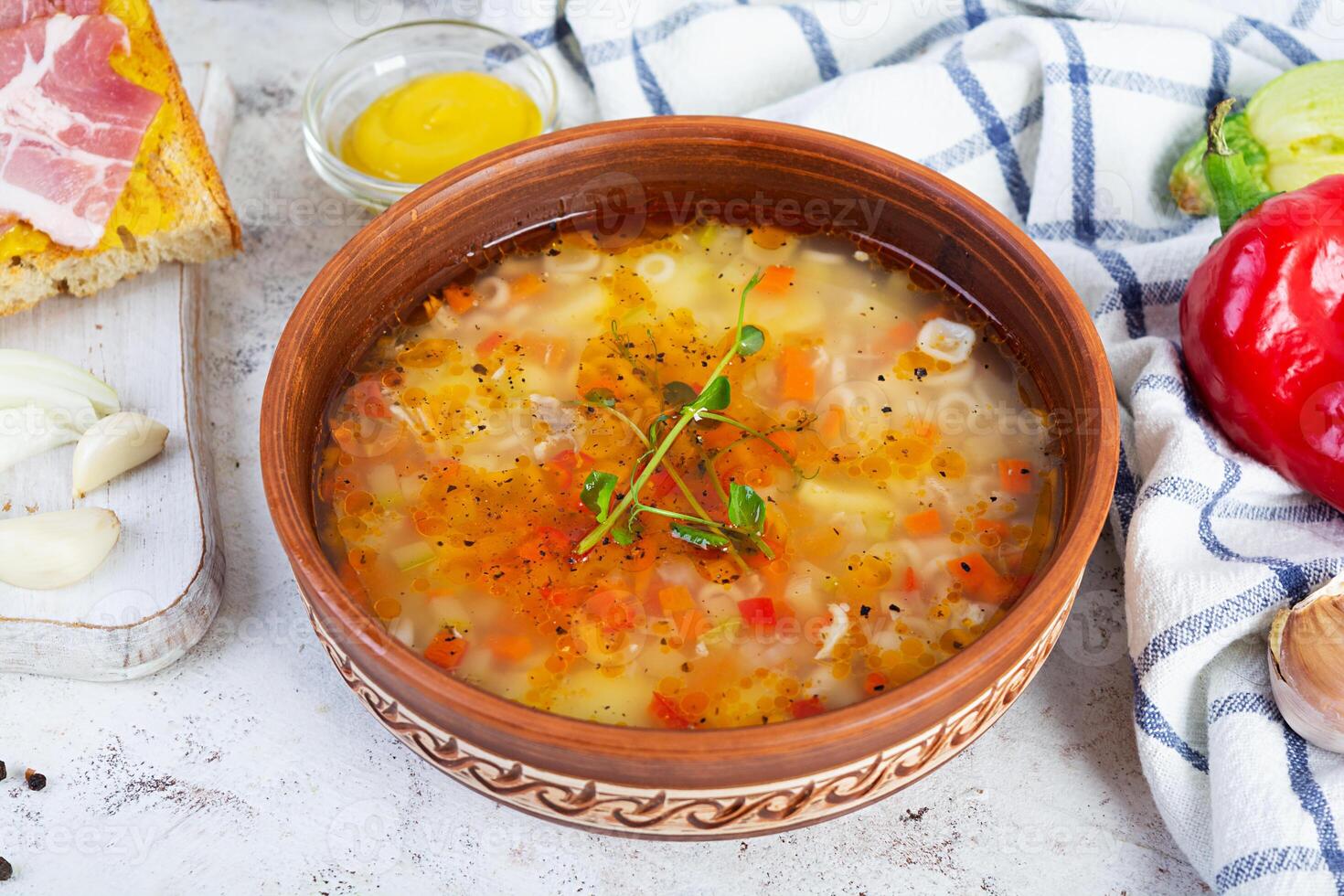 Minestrone soup. Vegetable soup with grilled bread, ham and spices photo