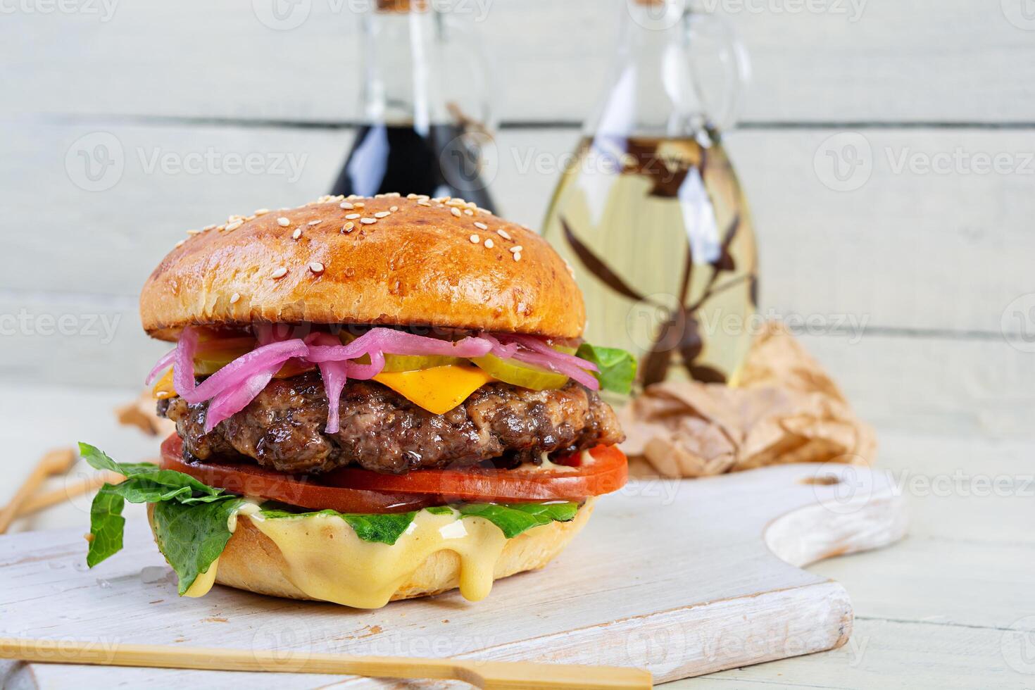 Delicious burger with beef meat, homemade bun and mayo photo