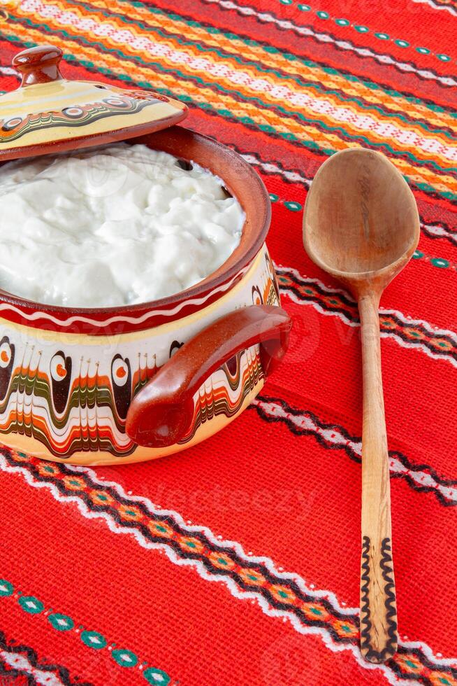 Bulgarian yogurt, in a ceramic bowl. photo