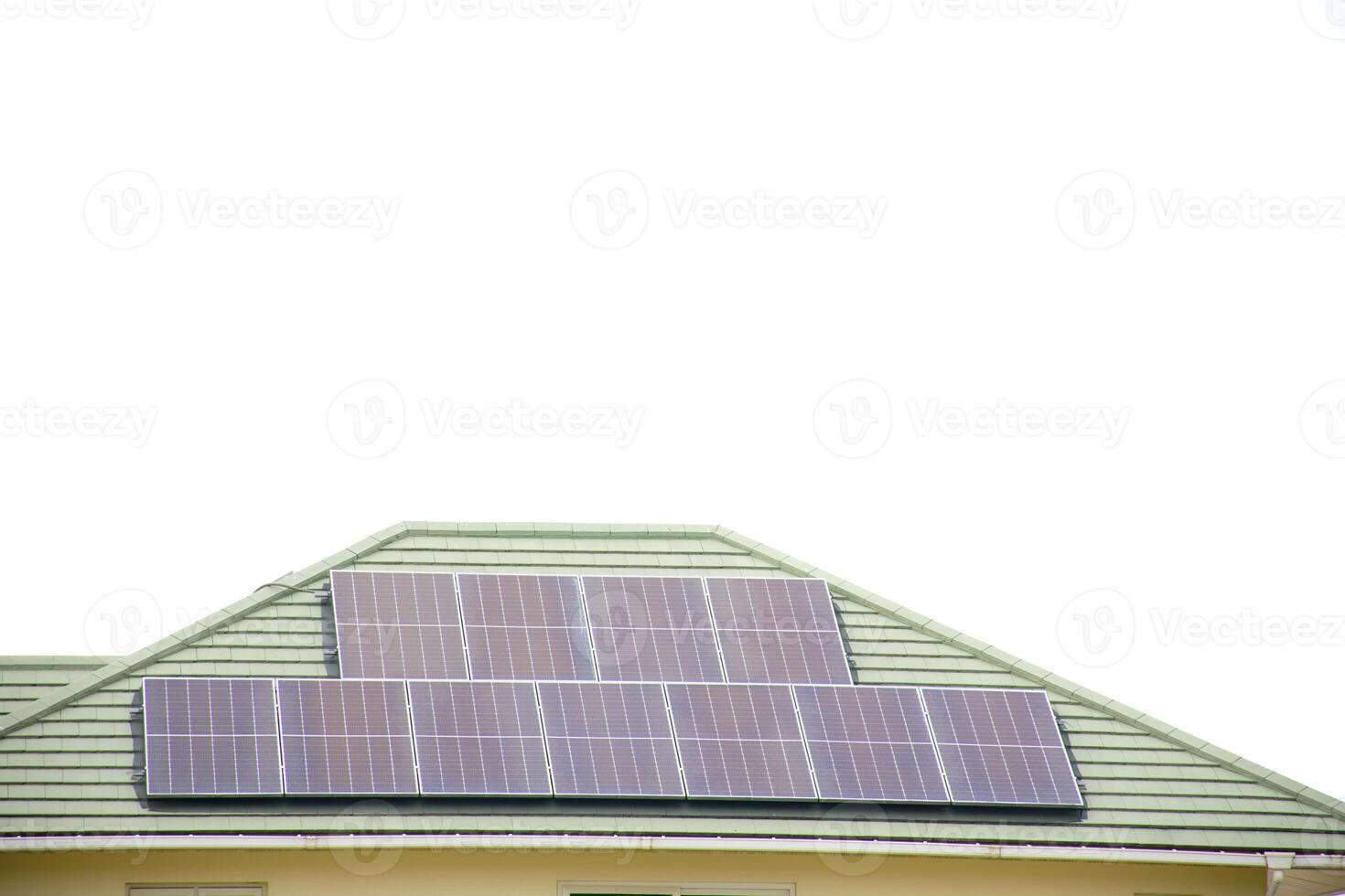 Installing a solar cell on a roof. Solar panels on roof. Modern house with modern solar panels on tile roof and wall against clear sky background 2025. photo