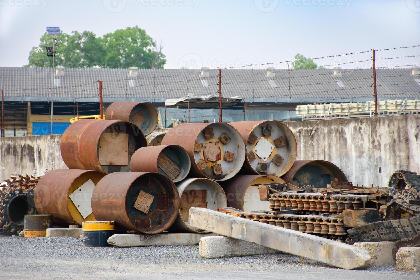 Industrial scrap metal that rusts is automotive industry parts and metal parts of large machines. Pile of various rusted industrial steel equipment on the floor in an factory 2025. photo